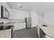 Modern kitchen with white cabinets, stainless steel appliances, and granite countertops at 567 Bay Leaf Dr, Poinciana, FL 34759