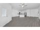 Open kitchen with island, stainless appliances, and modern finishes at 567 Bay Leaf Dr, Poinciana, FL 34759