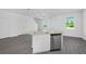 Kitchen island with stainless steel dishwasher, sink, and granite countertops at 567 Bay Leaf Dr, Poinciana, FL 34759