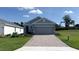Charming single-story home featuring a brick driveway and a well-manicured lawn at 4063 Nw 44Th Cir, Ocala, FL 34482