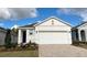 Charming single-Gathering home boasts a well-manicured lawn and a spacious two-car garage at 4067 Nw 44Th Cir, Ocala, FL 34482