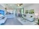 Open-concept living area with views of the kitchen, dining, and living areas, filled with natural light at 4067 Nw 44Th Cir, Ocala, FL 34482