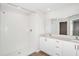 Modern bathroom with double vanity and a large shower at 2056 Marigold Aly, Winter Haven, FL 33884