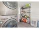 Laundry room with LG washer and dryer, and storage shelving at 7247 Treasure Island Rd, Leesburg, FL 34788