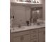 Double vanity bathroom with a large mirror and shower at 6638 Hatcher Rd, Lakeland, FL 33811