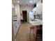 Spacious kitchen with white cabinets, granite countertops, and an island at 6638 Hatcher Rd, Lakeland, FL 33811