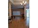 Large living room featuring hardwood floors and a chandelier at 6638 Hatcher Rd, Lakeland, FL 33811