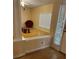 Bright living room featuring hardwood floors and a large window at 6638 Hatcher Rd, Lakeland, FL 33811