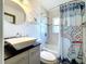 Modern bathroom with vessel sink, elegant elephant-themed shower curtain, and marble-look tile at 1803 Fredricksburg Ave, Lakeland, FL 33803