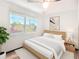 Serene bedroom featuring a large window with natural light, and wood-look flooring at 1803 Fredricksburg Ave, Lakeland, FL 33803