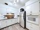 Modern kitchen featuring stainless steel appliances, white cabinets and ample counter space at 1803 Fredricksburg Ave, Lakeland, FL 33803
