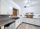 Bright kitchen featuring white cabinetry, modern appliances, and updated countertops at 1803 Fredricksburg Ave, Lakeland, FL 33803