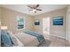 Virtually staged bedroom with light flooring and ensuite bathroom at 450 Avenue B Ne, Winter Haven, FL 33881