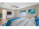 Virtually staged bedroom with a large window and en-suite bath at 450 Avenue B Ne, Winter Haven, FL 33881