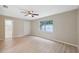 Bedroom with hardwood floors, ceiling fan and en-suite bathroom at 450 Avenue B Ne, Winter Haven, FL 33881