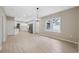 Bright dining room features hardwood floors and an elegant chandelier at 450 Avenue B Ne, Winter Haven, FL 33881