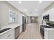 Modern kitchen with stainless steel appliances and white cabinets at 450 Avenue B Ne, Winter Haven, FL 33881