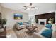 Virtually staged living room featuring a fireplace and ample natural light at 450 Avenue B Ne, Winter Haven, FL 33881