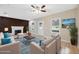 Stylish living room with a brick fireplace, hardwood floors, and comfortable seating arrangement at 450 Avenue B Ne, Winter Haven, FL 33881