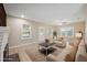 Virtually staged living room with hardwood floors at 450 Avenue B Ne, Winter Haven, FL 33881