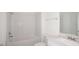 Clean bathroom, featuring a bathtub and white subway tile at 6826 Sw 90Th Loop, Ocala, FL 34476