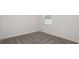 Minimalist bedroom with a carpeted floor and one window at 6826 Sw 90Th Loop, Ocala, FL 34476