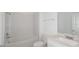 Bathroom featuring a tub with white tiled wall, vanity with sink, and modern fixtures at 6833 Sw 90Th Loop, Ocala, FL 34476