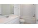 Bathroom featuring a vanity with sink and shower/tub combination with white subway tile at 6837 Sw 90Th Loop, Ocala, FL 34476
