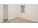 Bedroom with closet, neutral carpet, and a bright window at 6837 Sw 90Th Loop, Ocala, FL 34476