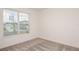 Vacant bedroom with a large window offering natural light and neighborhood views at 6837 Sw 90Th Loop, Ocala, FL 34476