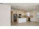 Modern kitchen featuring stainless steel appliances, white cabinets, and a central island at 6837 Sw 90Th Loop, Ocala, FL 34476