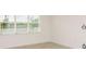 Bright room features tile flooring and a large window providing ample natural light at 6837 Sw 90Th Loop, Ocala, FL 34476