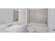Clean bathroom featuring a bathtub and quartz countertop at 6829 Sw 90Th Loop, Ocala, FL 34476
