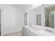 Bathroom with double vanity and a walk-in shower at 6829 Sw 90Th Loop, Ocala, FL 34476