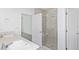 Bathroom with double vanity and a walk-in shower at 6829 Sw 90Th Loop, Ocala, FL 34476