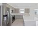 Modern kitchen with stainless steel appliances and island at 6829 Sw 90Th Loop, Ocala, FL 34476