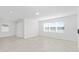 Bright living room features tile flooring, neutral decor with many windows, and recessed lighting at 6829 Sw 90Th Loop, Ocala, FL 34476