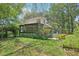 Exterior shot showcasing the backyard with a sunroom and deck at 3603 Cr 626N, Bushnell, FL 33513