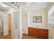 Well-lit bathroom featuring wood cabinets, sink, toilet, and a glass shower door at 3603 Cr 626N, Bushnell, FL 33513