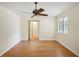Bedroom with wood flooring and an open door to another room at 3603 Cr 626N, Bushnell, FL 33513