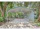 Carport adjacent to home set amongst lush landscaping at 3603 Cr 626N, Bushnell, FL 33513