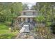Inviting home featuring a covered front porch, well-maintained landscaping, and a welcoming walkway at 3603 Cr 626N, Bushnell, FL 33513