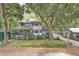 Charming two-story home with lush greenery surrounding the property at 3603 Cr 626N, Bushnell, FL 33513