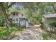 Charming two-story home with lush greenery surrounding the property at 3603 Cr 626N, Bushnell, FL 33513