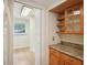 Kitchen cabinet with countertop, offering storage and workspace, plus a sun tunnel for extra lighting at 3603 Cr 626N, Bushnell, FL 33513