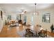 Comfortable living room with hardwood floors, wood stove, and plentiful natural light at 3603 Cr 626N, Bushnell, FL 33513