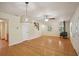 Open living room with hardwood floors, wood stove, and view to adjacent spaces at 3603 Cr 626N, Bushnell, FL 33513