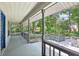 Inviting porch with gray railings, perfect for enjoying the outdoor scenery at 3603 Cr 626N, Bushnell, FL 33513