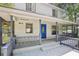 Covered porch with gray railings and blue front door, offering a relaxing outdoor space at 3603 Cr 626N, Bushnell, FL 33513