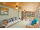 Relaxing sunroom with wood ceiling, lots of windows and comfortable seating at 3603 Cr 626N, Bushnell, FL 33513